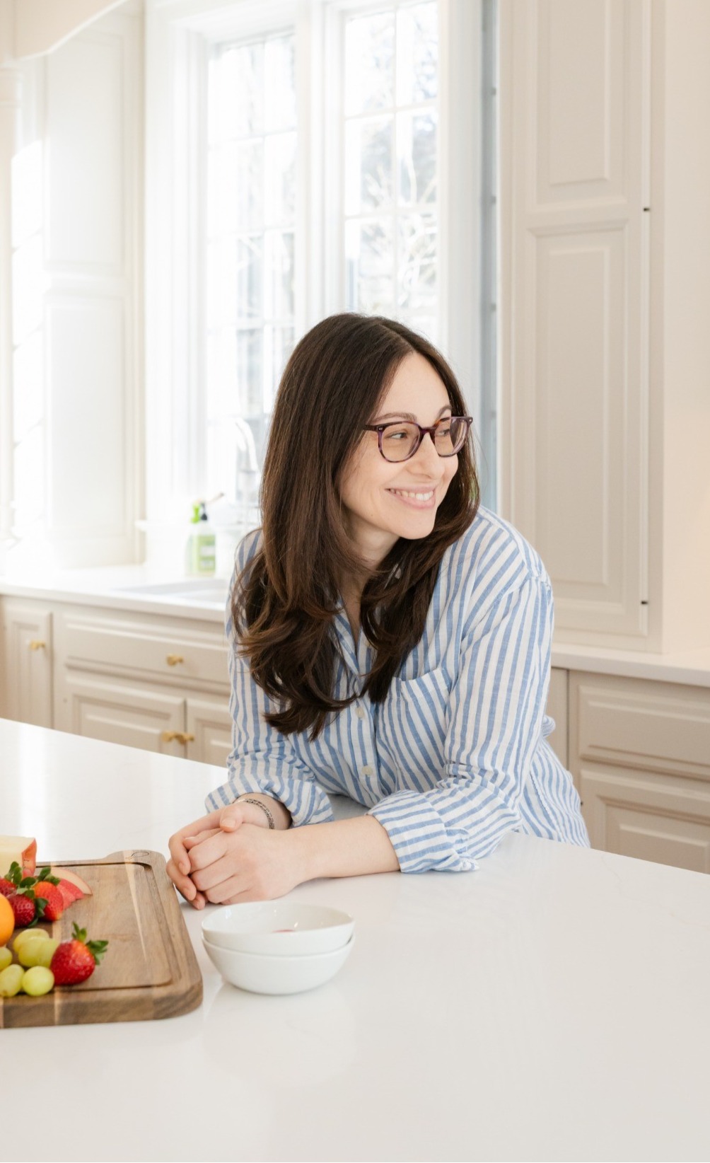 Lisa smiling in a bright kitchen